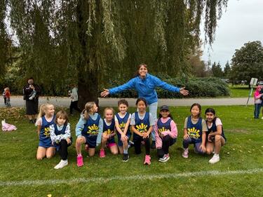 Coach with girls cross country team