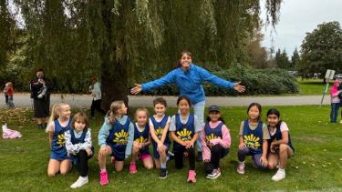 Coach with girls cross country team