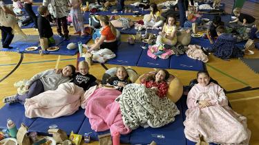 Students Watching Movie in Gym