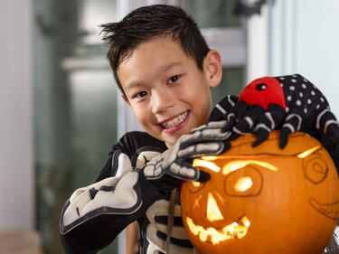 School aged boy celebrating Halloween 