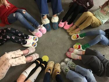 Students with Mocs and Slippers
