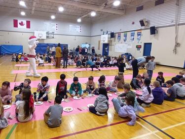 Students Eating Pancakes in the Gym