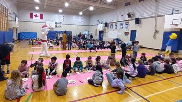 Students Eating Pancakes in the Gym