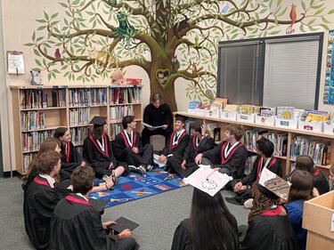 Story time in the library with Grade 12 Graduates 