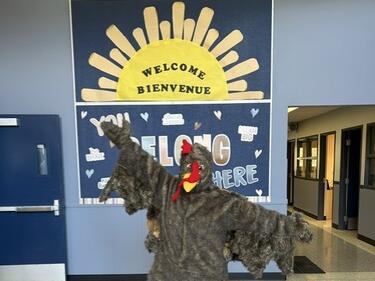 Sandy Hill Turkey in Front of Welcome Bulletin