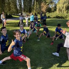Boys Cross Country Stretching with Coach