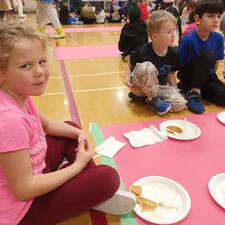 Students Enjoying Pancakes in the Gym