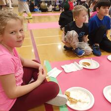 Students Enjoying Pancakes in the Gym