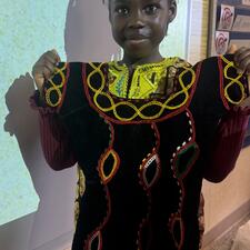 Student Displaying Cultural Item