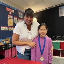 Student with Public Speaking Medal