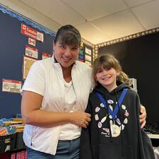 Student with Public Speaking Medal