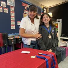 Student with Public Speaking Medal