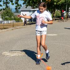 Female elementary student plays skipping game