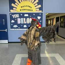 Sandy Hill Turkey in front of Welcome Bulletin Board